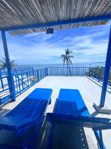 a view of the ocean from the deck of a resort at Three Trees Samui Resort - Sarocha Villa in Lamai