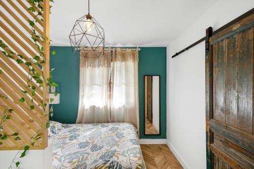 Ένα ή περισσότερα κρεβάτια σε δωμάτιο στο Jolie maisonnette paisible