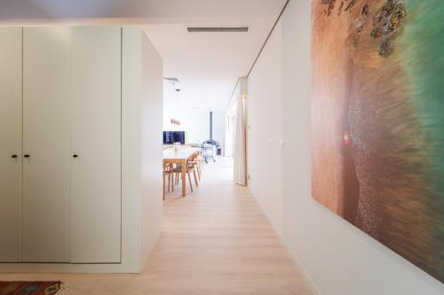 a hallway of a house with a painting on the wall at Viana Vista Villa in Viana do Castelo