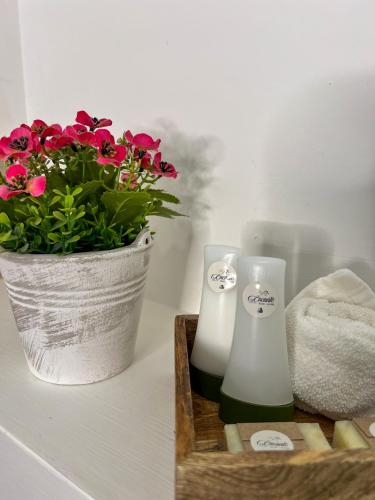 a basket of flowers and two candles on a counter at VILLAS EL ENCANTO in Jalpan