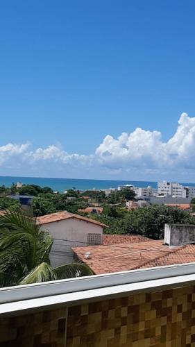 a view of the ocean from a roof at Flat Litoral Sul da Paraíba- Praia Carabibus in Conde