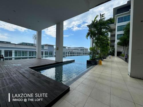 a swimming pool in the middle of a building at The Loft Imago by LAXZONE in Kota Kinabalu