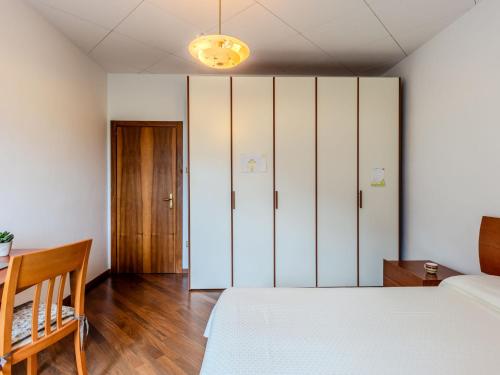 a bedroom with a bed and a closet at Apartment SunnyLake by Interhome in Riva del Garda