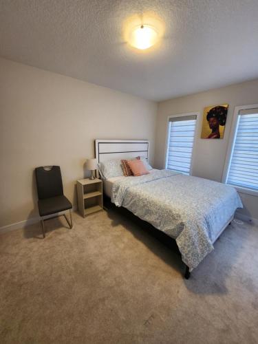 Ένα ή περισσότερα κρεβάτια σε δωμάτιο στο Glow Chambers at Thorold