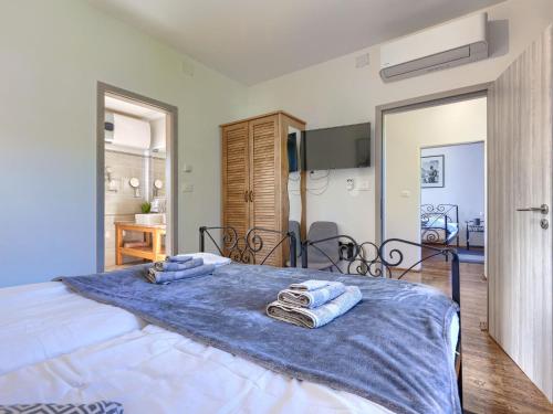 Katil atau katil-katil dalam bilik di Villa Tina by Interhome