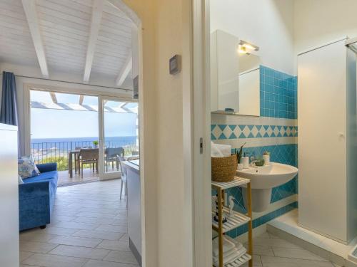 a bathroom with a view of the ocean at Apartment Attico Vista Isola by Interhome in Trinità dʼAgultu