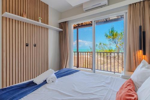 Una cama o camas en una habitación de Beach Living #E501 - Apto Vista Mar por Carpediem