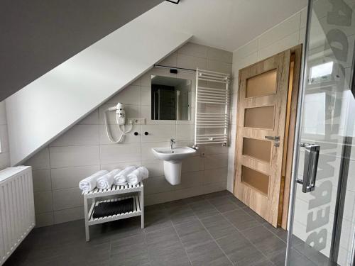 a bathroom with a sink and a sink at Apartmány U Bernharda in Vítkov