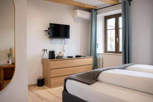 Ένα ή περισσότερα κρεβάτια σε δωμάτιο στο Gîte La Grange