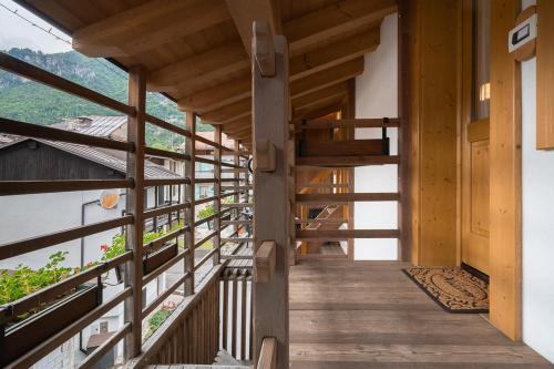 a wooden corridor in a wooden house with wooden stairs at Albergo Diffuso Dolomiti in Forni di Sotto