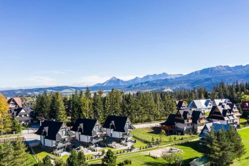an aerial view of a resort with mountains in the background at Domki przy Szlaku Pod Gubałówką in Zakopane