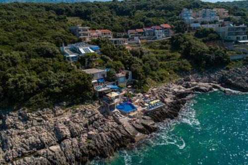 an aerial view of a resort on a rocky coast at Vila Gloria in Bar