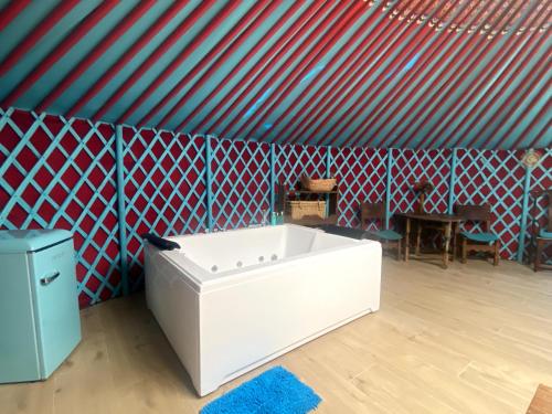a room with a large white tub in a tent at Cortijo Boutique Marbella in Marbella