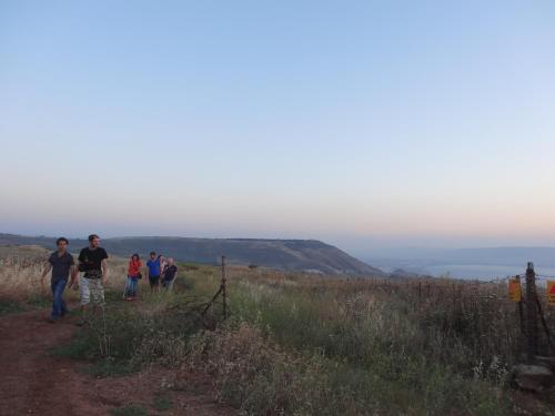 a group of people walking up a hill at Sea of Galilee - Genghis Khan in The Golan in Giv'at Yo'av