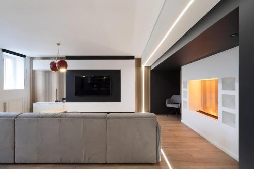 TV a/nebo společenská místnost v ubytování L'Esplanade