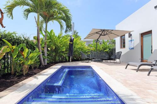 a swimming pool in the backyard of a house at 6 Bedroom Villa with Pool & Parking in Heart of South Beach Miami in Miami Beach