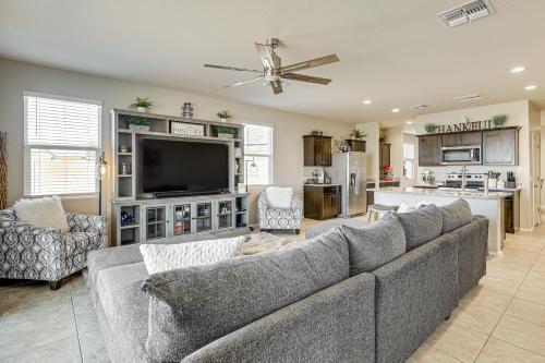 a living room with a couch and a tv at Florence Home about 10 Mi to Historic District! in Florence