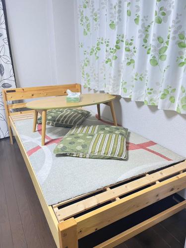 Postel nebo postele na pokoji v ubytování 天六inn