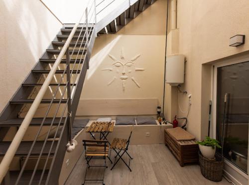 a staircase in a room with chairs and aitating at SUNSHINE House in Alicante