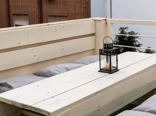 a lantern sitting on the ledge of a balcony at SUNSHINE House in Alicante
