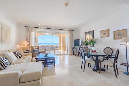 a living room with a couch and a table at Sea view apartment Nautico Suites in San Miguel de Abona