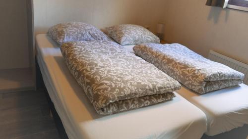 Postel nebo postele na pokoji v ubytování Camping De Bosrand