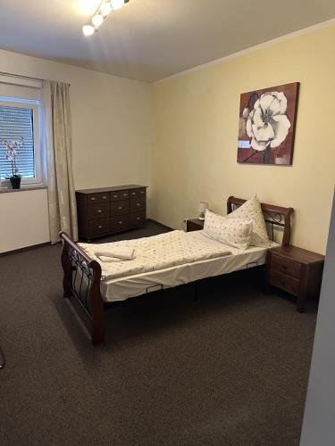 a bedroom with a large bed and a window at Pension Zur Traube 2 in Bergheim