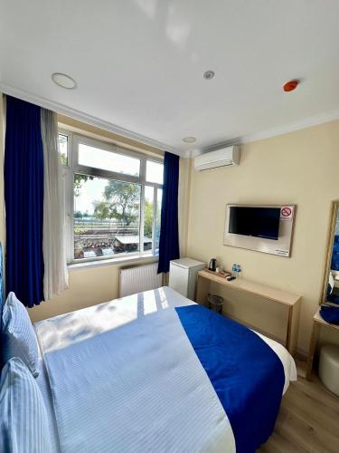 Postel nebo postele na pokoji v ubytování Grand Ararat Hotel