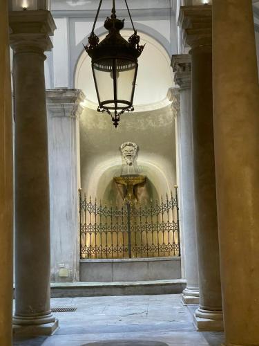 a chandelier hanging over a gate in a building at The First Luccoli Garibaldi Rolli in Genova
