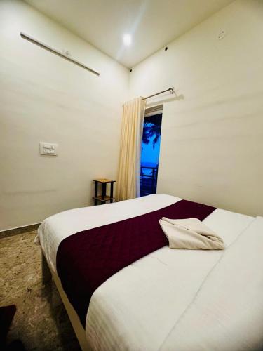 Ένα ή περισσότερα κρεβάτια σε δωμάτιο στο Alivious Beach Homestay