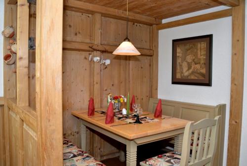 a dining room with a table with red napkins on it at Parkhotel Helene in Bad Elster