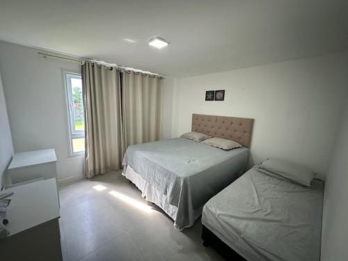 Ένα ή περισσότερα κρεβάτια σε δωμάτιο στο Gamboa do morro de sao paulo