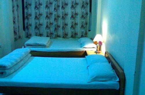 Postel nebo postele na pokoji v ubytování Hotel J P Lodge Kalimpong