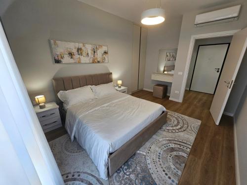 Llit o llits en una habitació de Amara Apartment