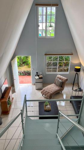 a living room with a glass table and a couch at VILLAS EL ENCANTO in Jalpan
