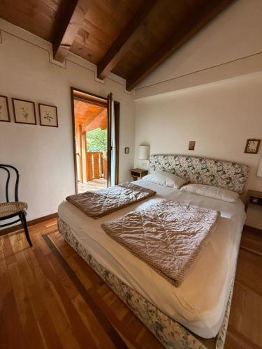 Ένα ή περισσότερα κρεβάτια σε δωμάτιο στο Panciroli Pinzolo Funivia