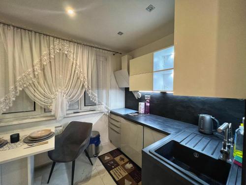 Η κουζίνα ή μικρή κουζίνα στο Útulný apartmán v Zlatých Moravciach