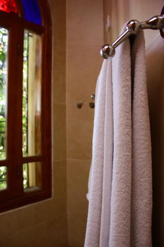 a towel hanging on a towel rack in a bathroom at Riad Noumidya in Fès