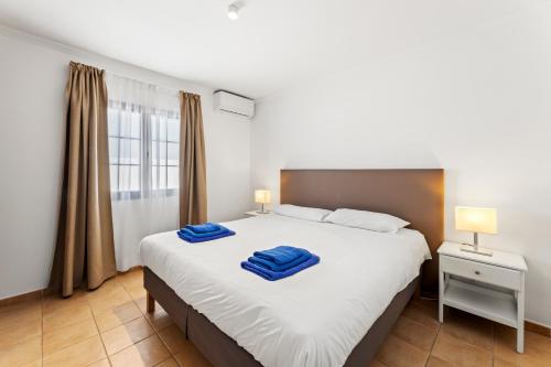 Postel nebo postele na pokoji v ubytování Lanzarote Villa Volcan 7
