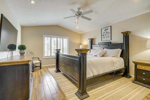 a bedroom with a bed and a ceiling fan at Hot Tub and Patio Family Gem in Avondale in Avondale