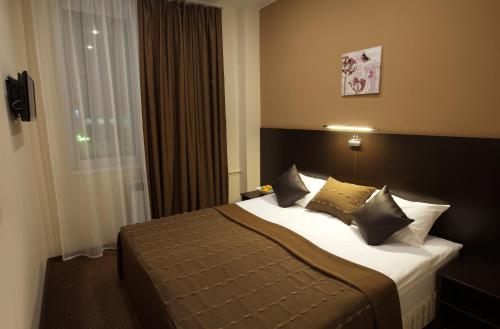 เตียงในห้องที่ Hotel Krokus