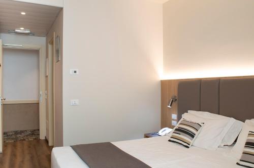 Postel nebo postele na pokoji v ubytování Hotel Alexander