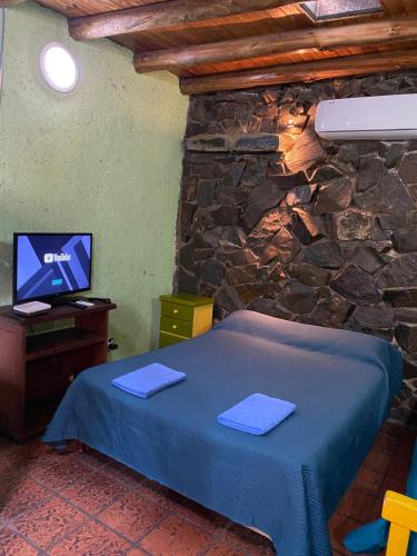 Ένα ή περισσότερα κρεβάτια σε δωμάτιο στο Hostel Ruca Potu