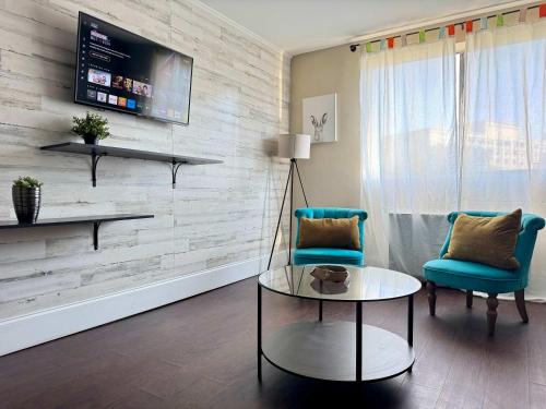 a living room with two chairs and a table at Styled Downtown condo City View Onsite Parking LM404 in Atlanta