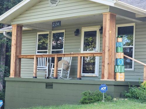 a house with a porch with chairs on it at My Hideaways Serinity Hill in Hardy