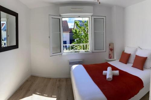 Ένα ή περισσότερα κρεβάτια σε δωμάτιο στο Ravissante maison en bord de mer