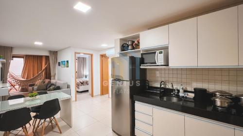 a kitchen and living room in a apartment at Eco Summer Tambaú WB Genius Flats in João Pessoa