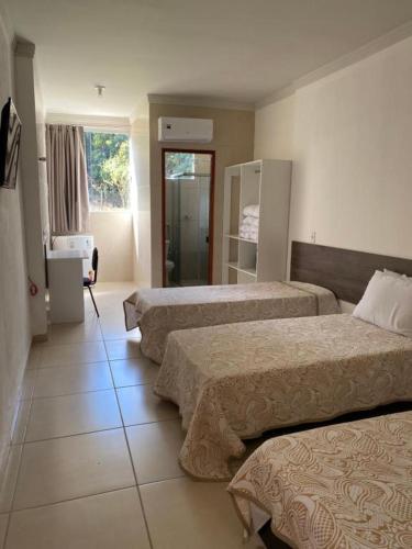 Katil atau katil-katil dalam bilik di Ribeiro Suit's Hotel