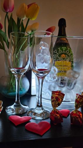 three wine glasses sitting on top of a table at Gliù Vico in Formia