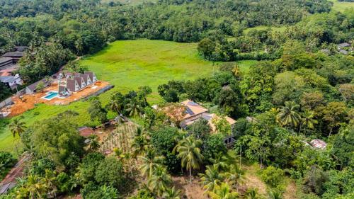 an aerial view of a house in the forest at Samalanka Boutique Hotel in Habaraduwa